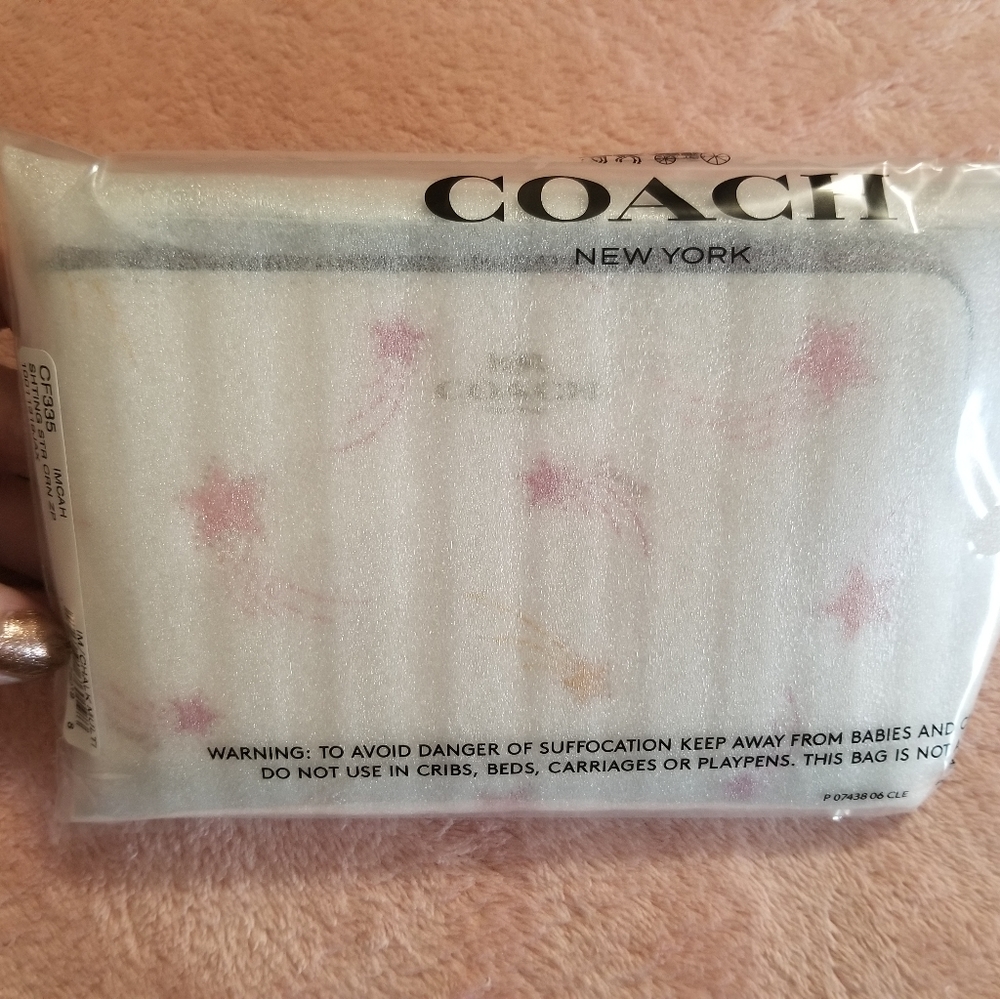 Coach corner zip wristlet in shooting star